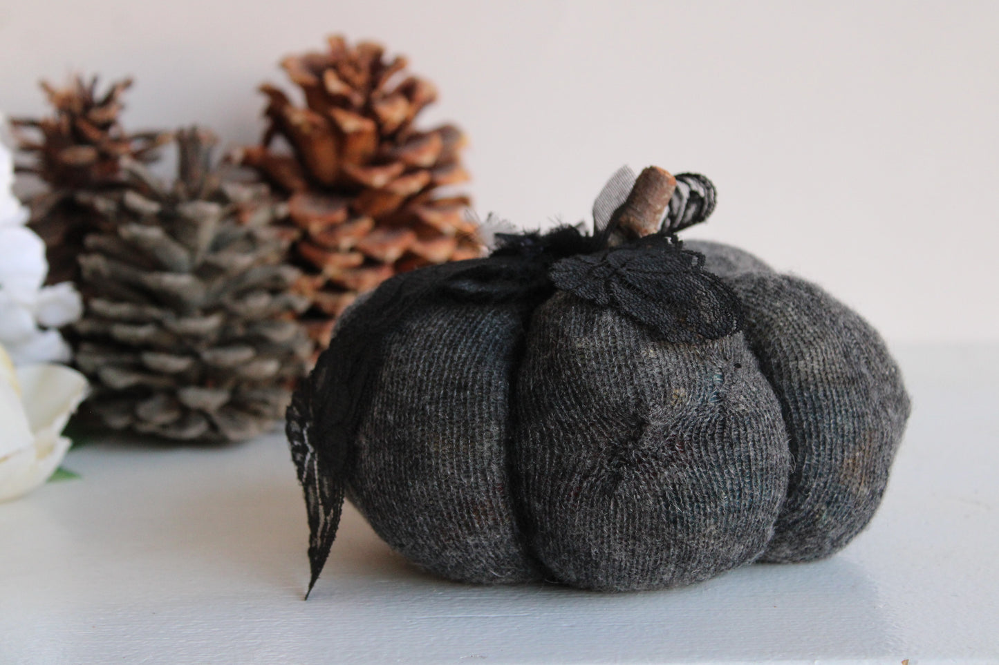Knit Gray Cashmere Pumpkin Pillow With Black Lace, Flowers and a Stick Stem