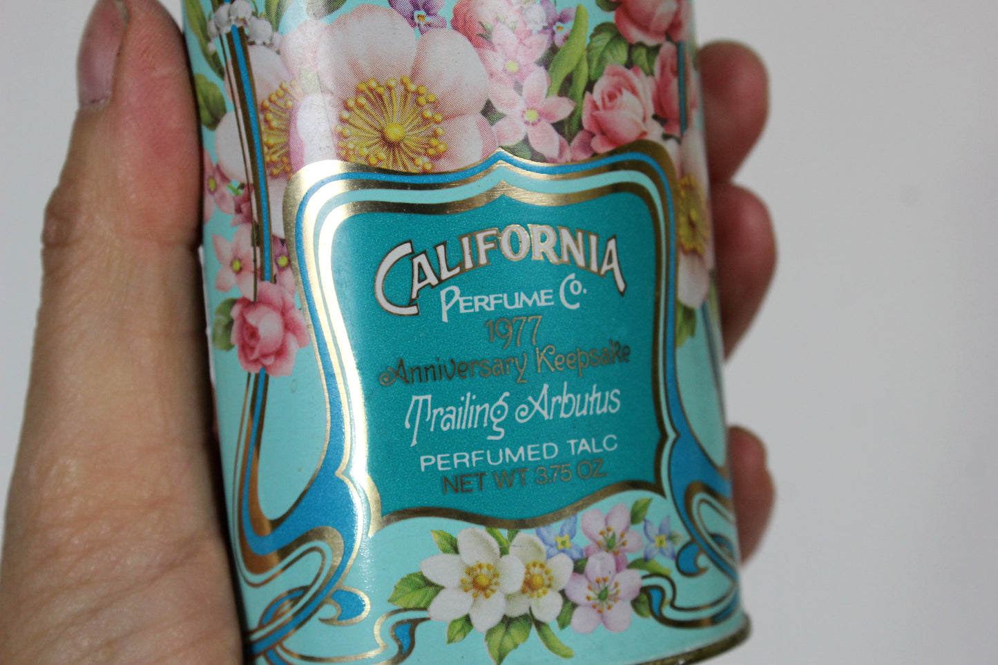  1970s Avon California Trailing Arbutus Perfumed Talc Powder Tin