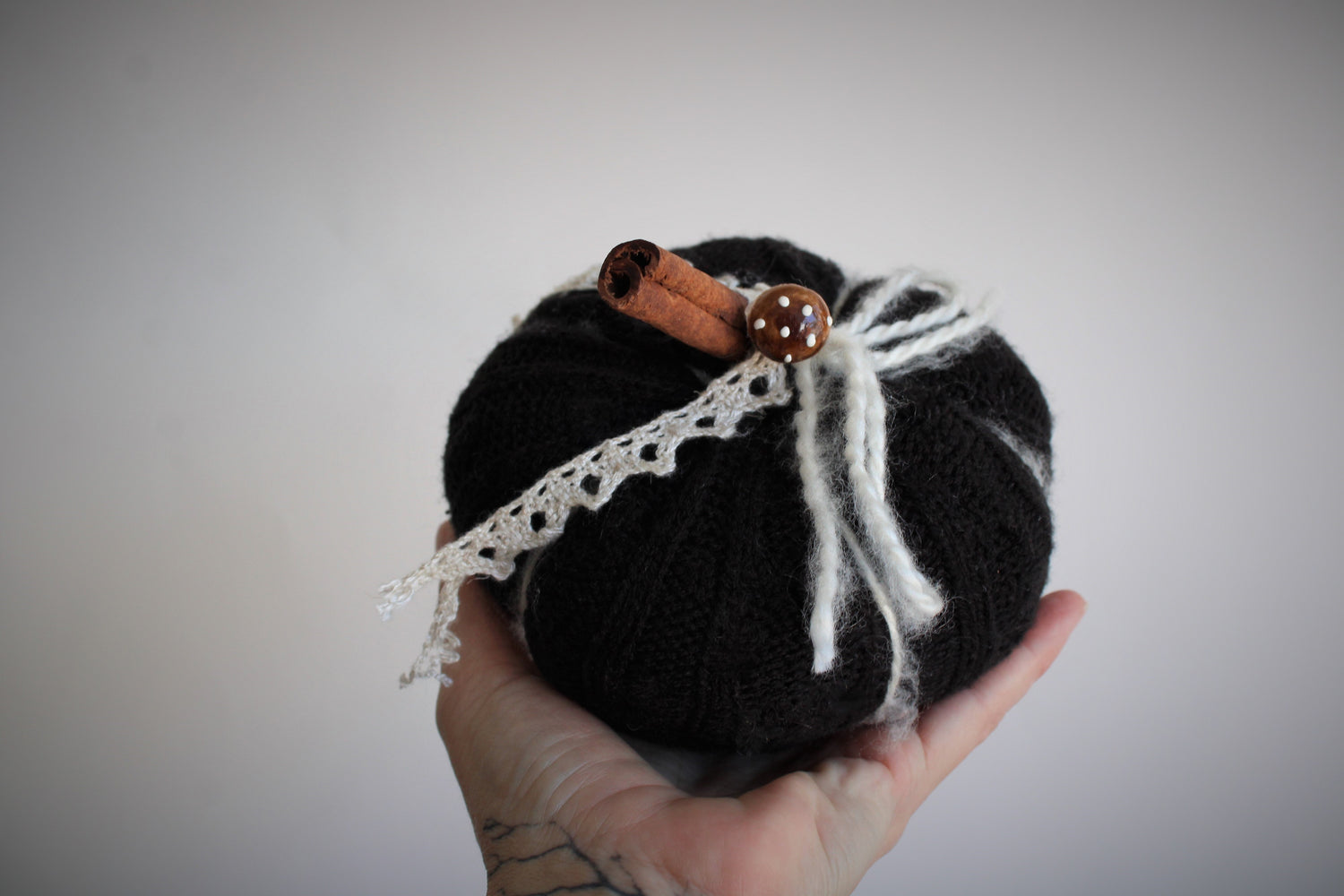 Black Knit Pumpkin Pillow Pouf, With Ivory Lace, Mini Toadstool and Cinnamon Stick Stem