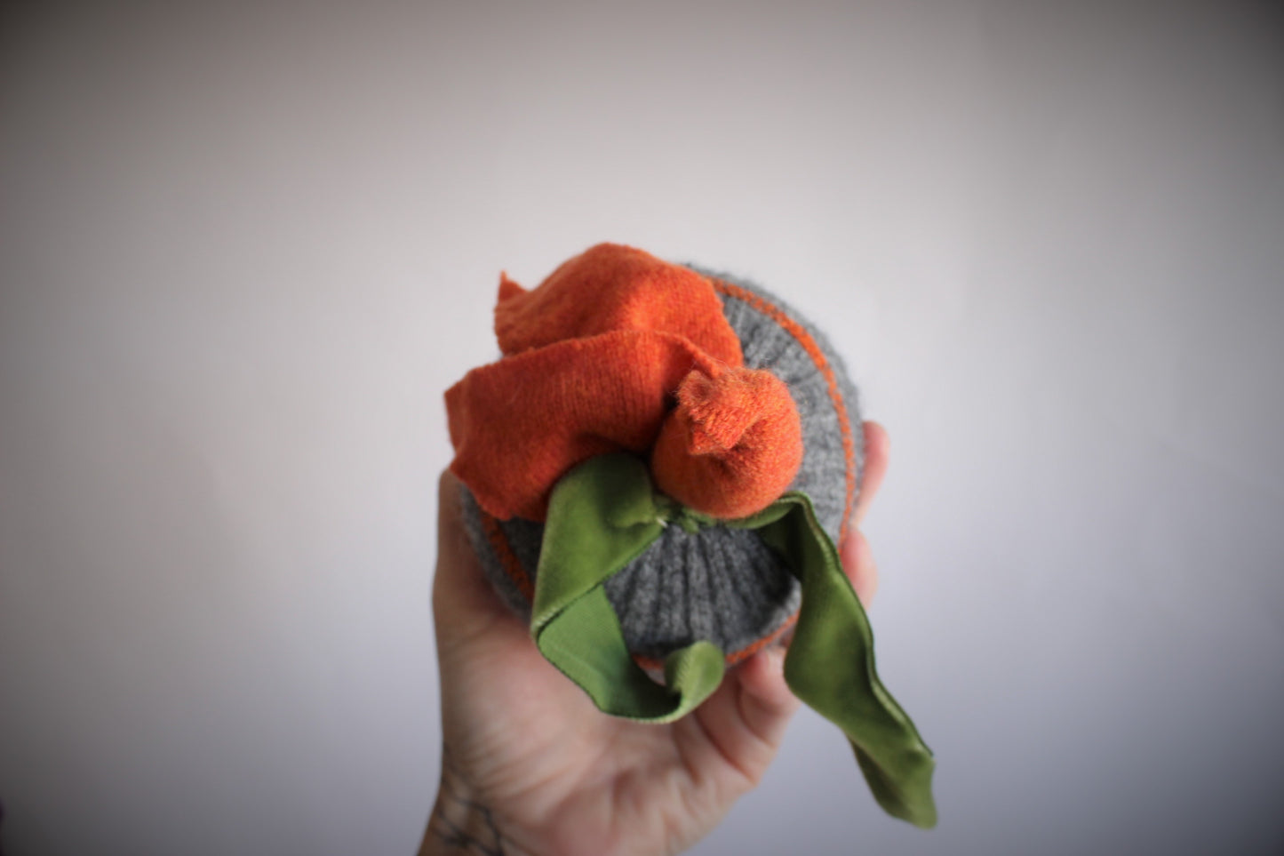 Knit Pumpkin Pillow Pouf in Gray with Orange Leaves and Green Velvet Ribbon