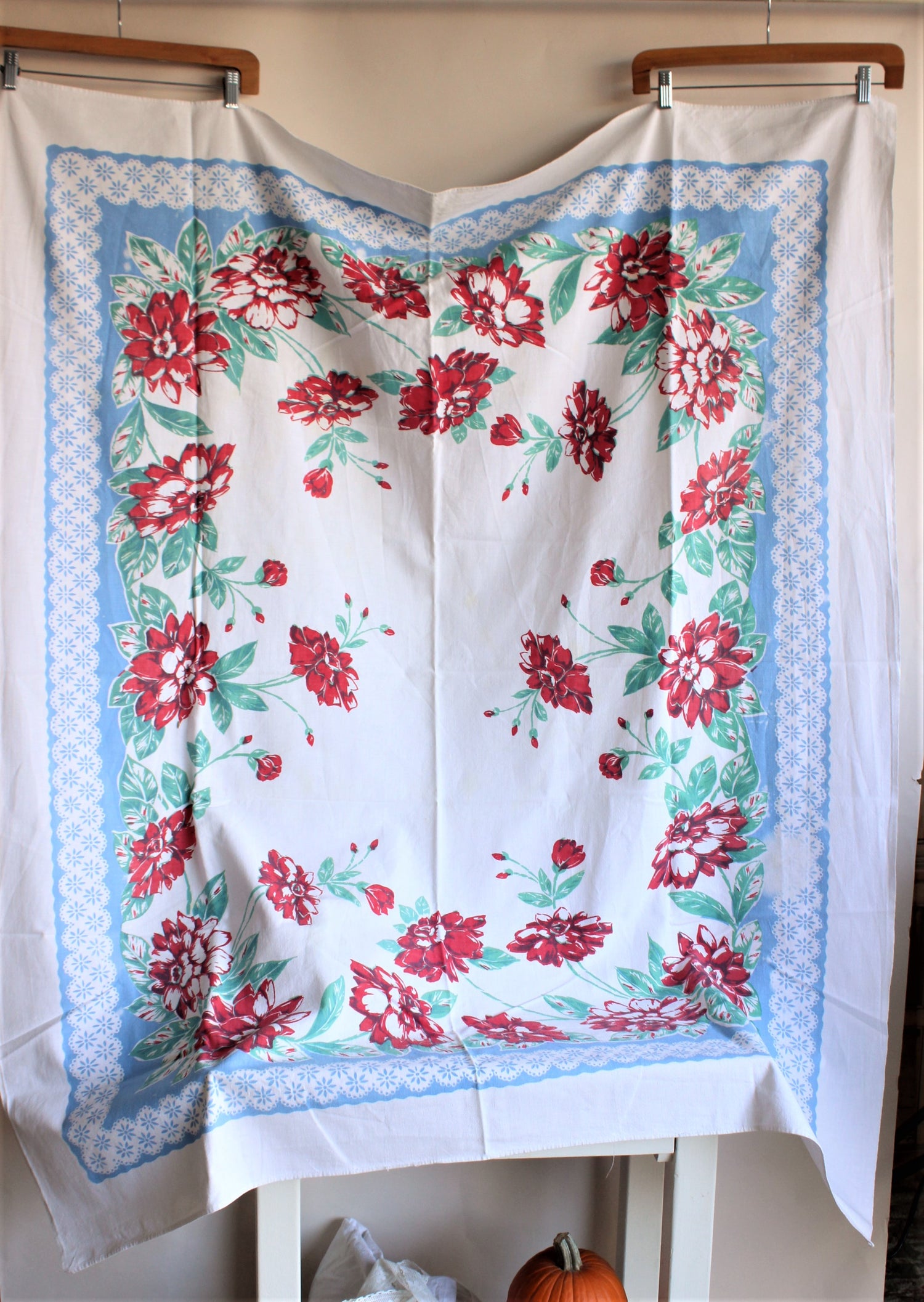 Vintage 1940s, 1950s Tablecloth with red flowers and blue borders